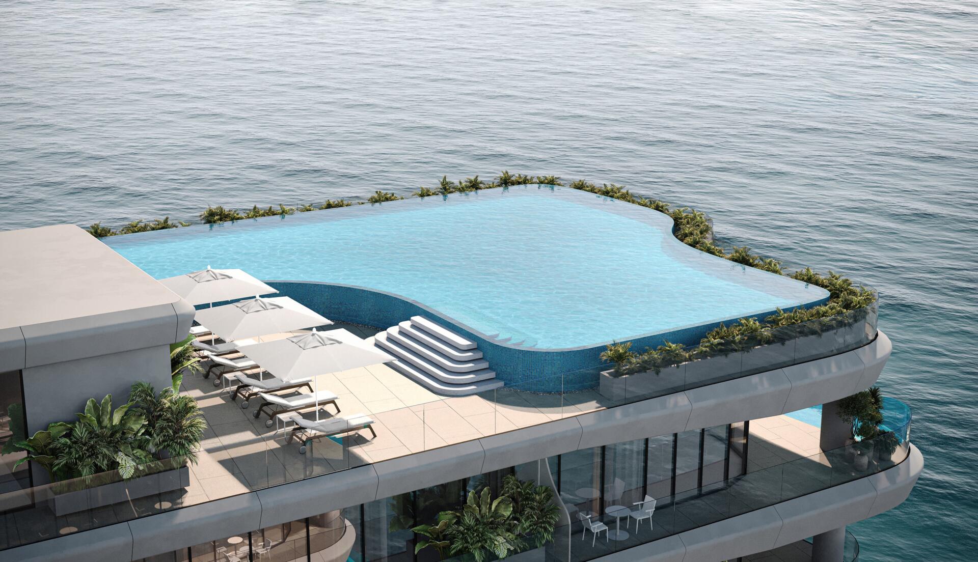 Piscine à débordement sur le toit avec vue panoramique